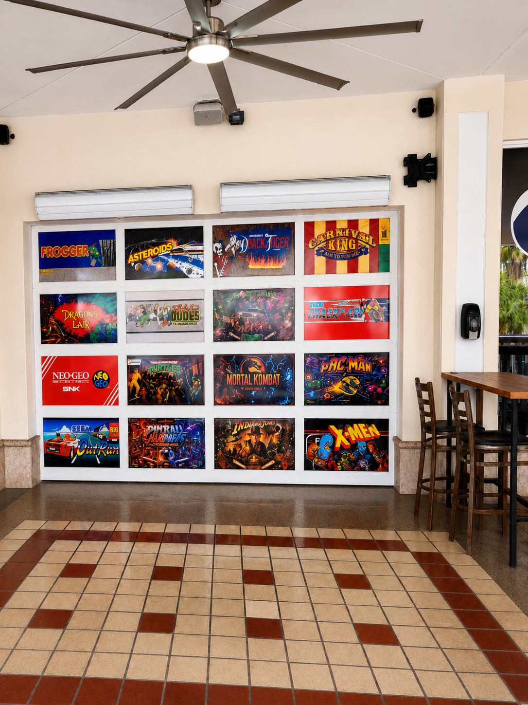 Custom printed arcade game graphic panels installed on an interior wall